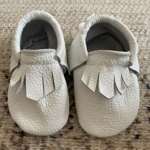 Mighty Moc white baby moccasins. Size 1 (0-6 months) new without tags.